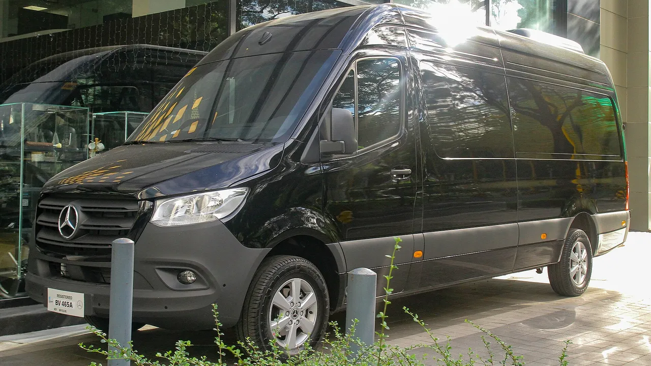 Black Mercedes-Benz Sprinter van parked at a curb